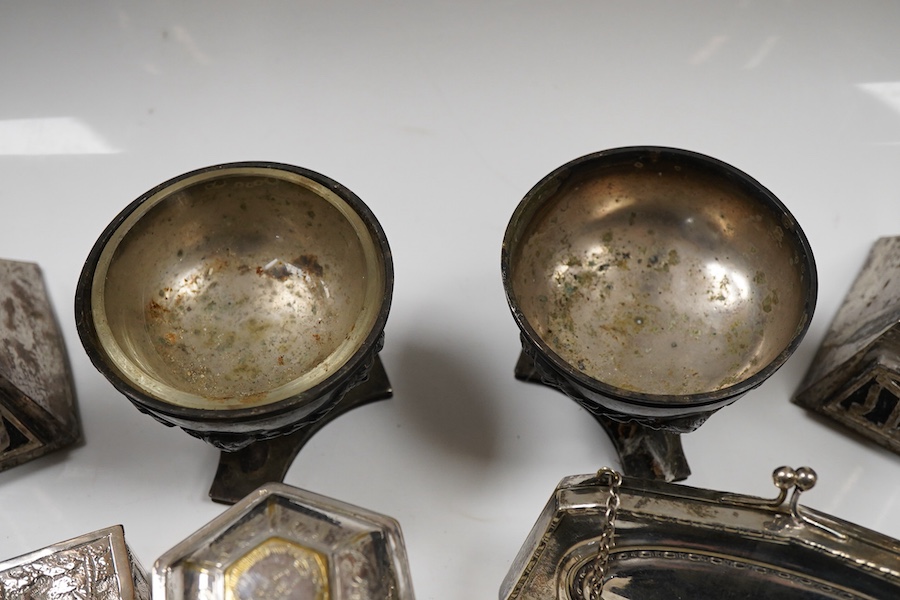An Edwardian silver vesta case, Birmingham, 1902, 42mm, together with a small Indian white metal box, a pair of white metal Soviet? candlesticks, a plated purse, a plated belt, a hexagonal box and cover stamped MMA and a